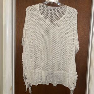 Crocheted poncho with fringe​